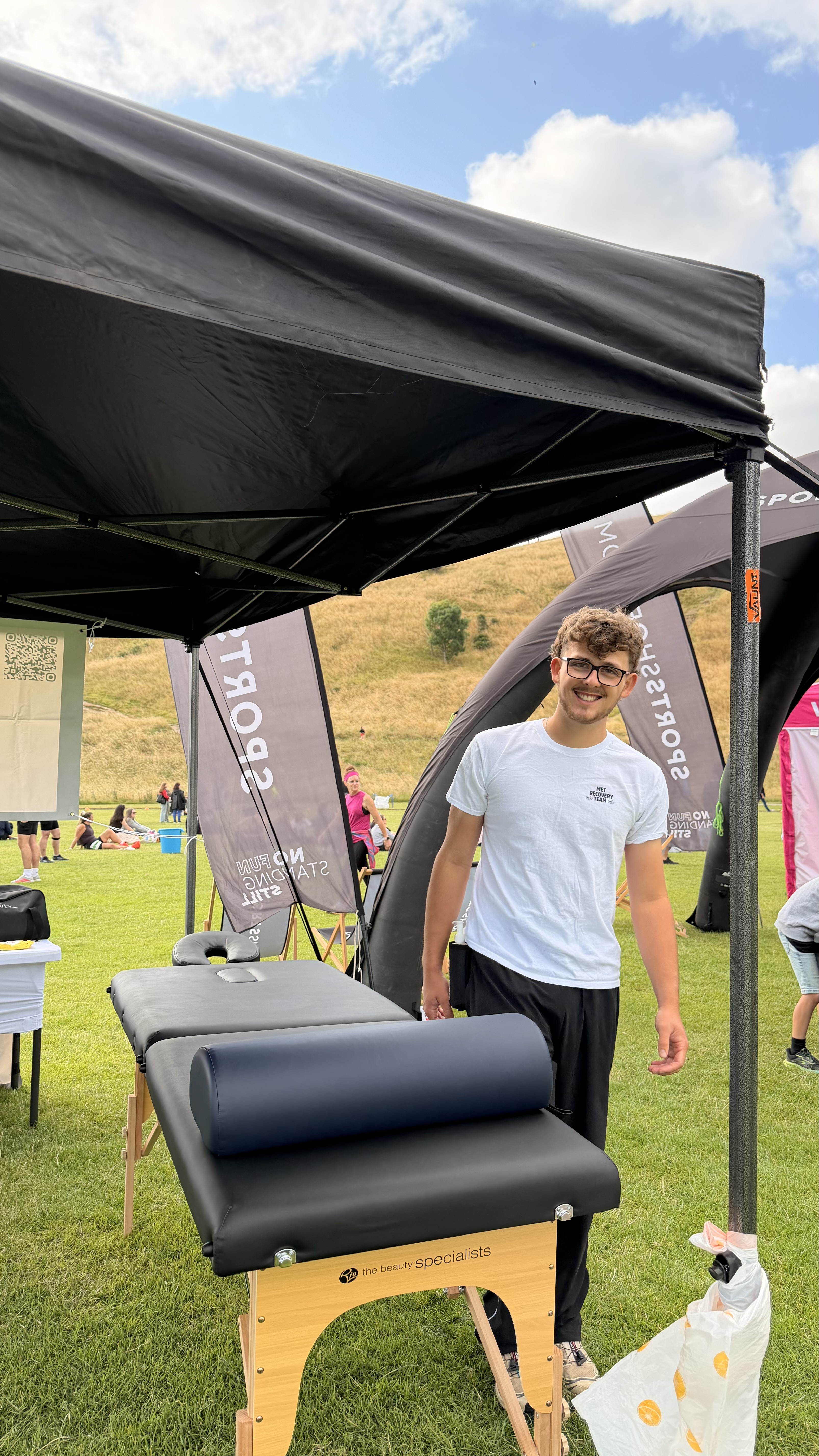 Tobi, sports massage therapist at Total Body Rehabilitation, working with a client